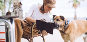 girl with her dog in cafe