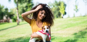 girl with her dog in park