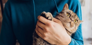 man holding cat